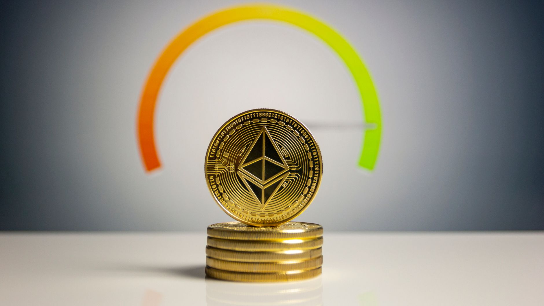 Stack of Ethereum coins with a color gradient background signifying cryptocurrency dynamics.