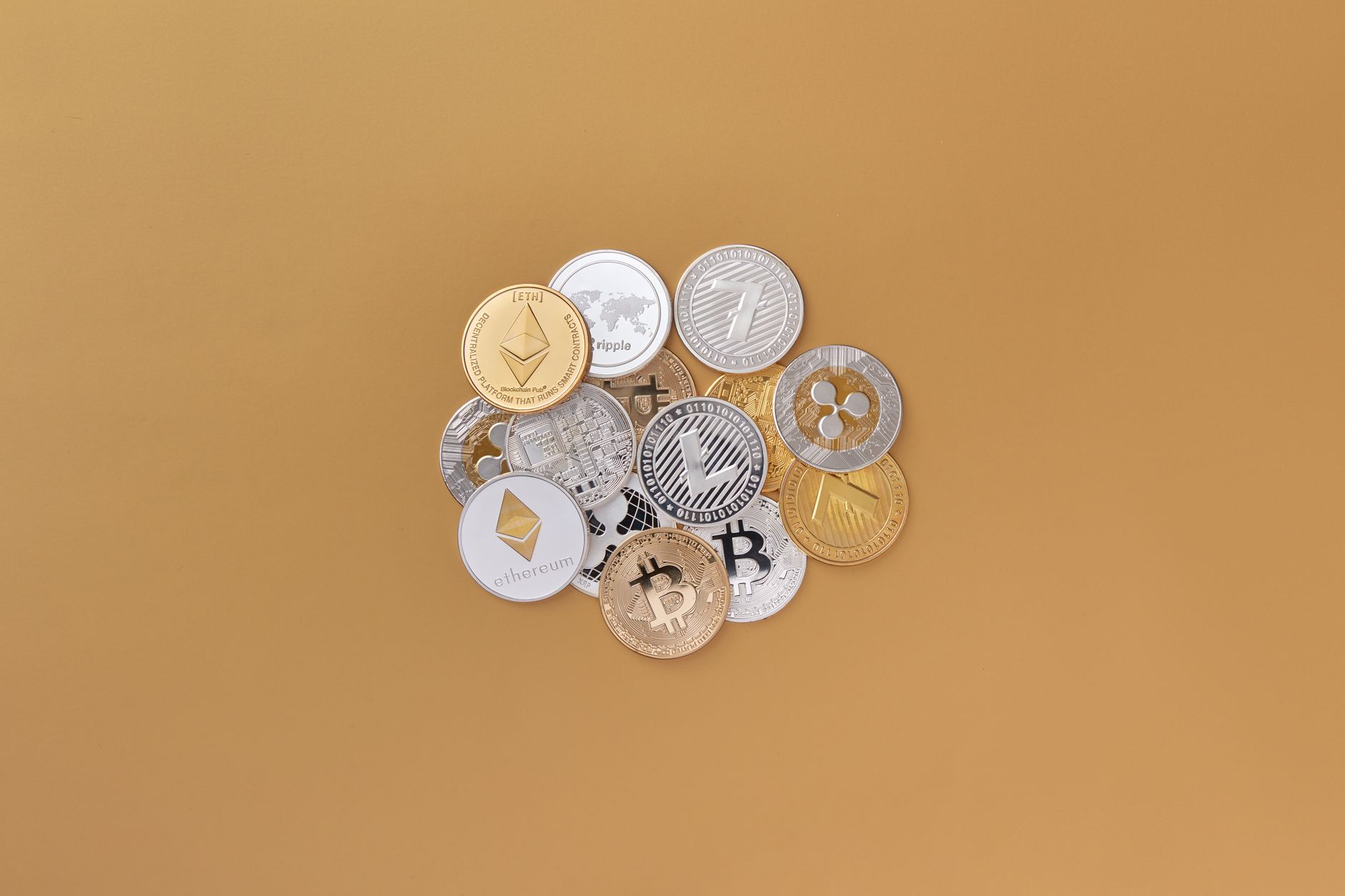 A cluster of cryptocurrencies including Bitcoin, Ethereum on a subtle background symbolizing digital finance.